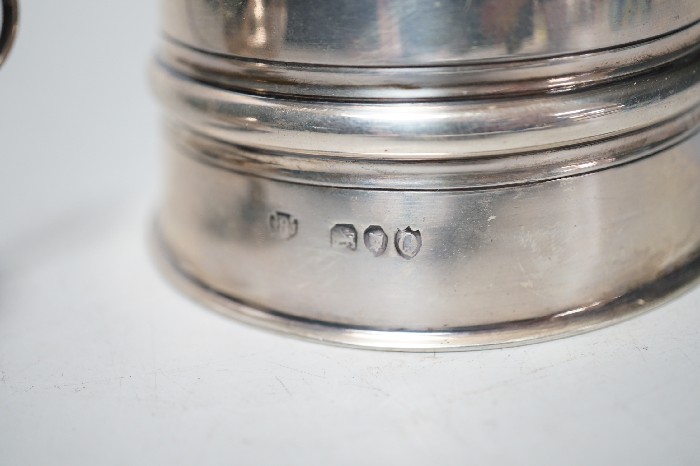 A late Victorina silver inkwell with five pen recesses, William & John Barnard, London 1889, diameter 86mm, and a small George V silver 'Aladdin's lamp' lighter.